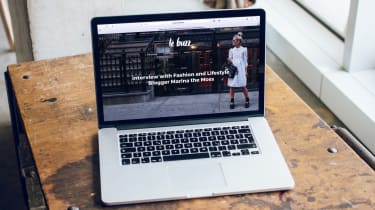laptop open on desk on business website
