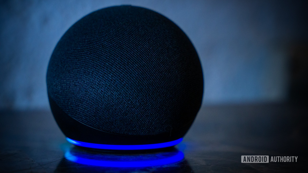 Amazon Echo Dot Alexa speaker with light ring turned on stock photo 2